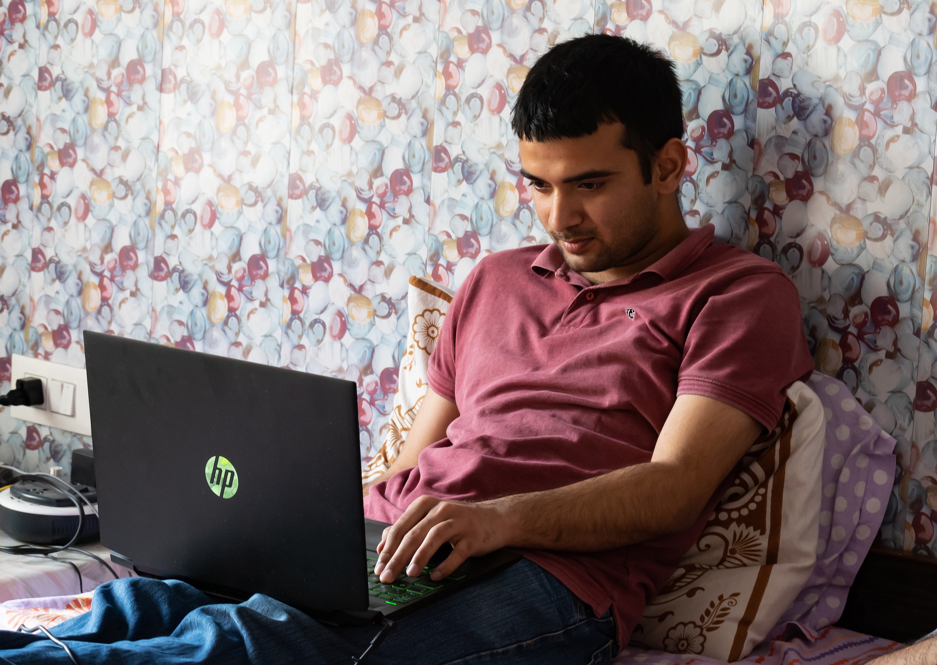 Man hunched over laptop